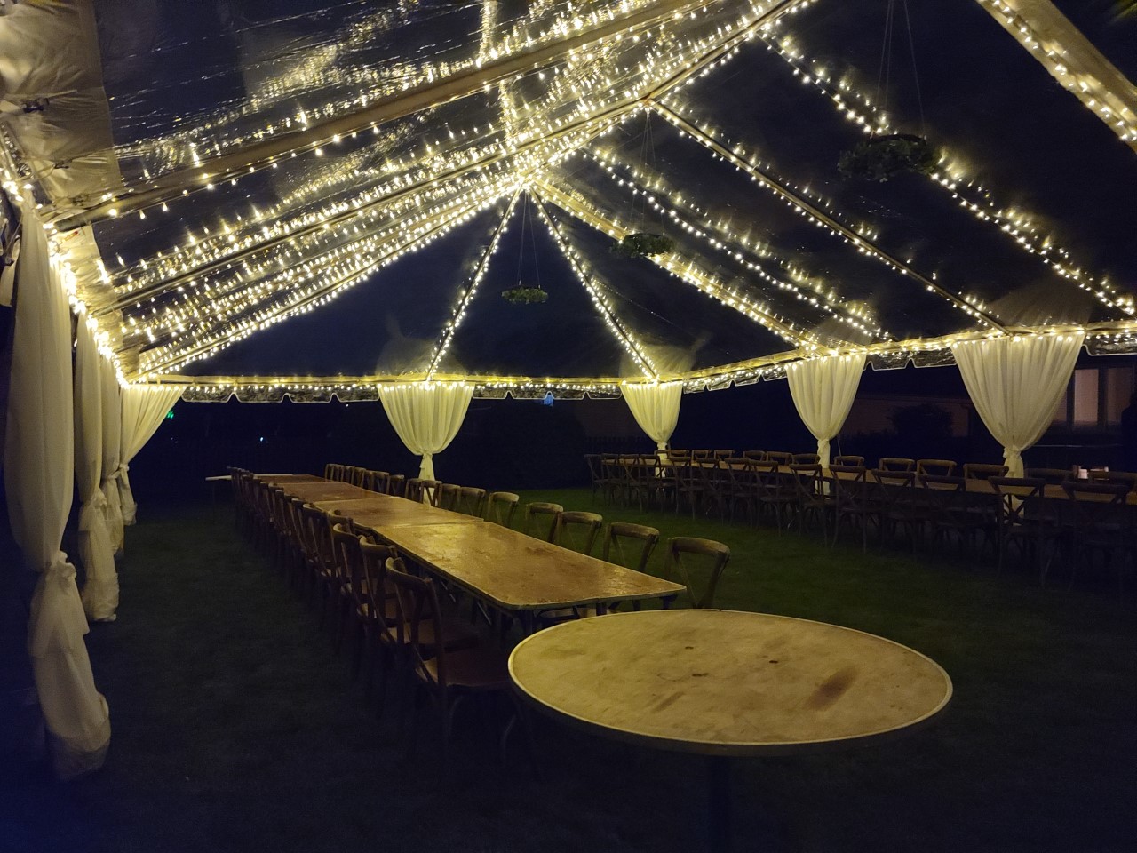 30x50 Clear Tent at Night with Italian Ice Lights & Curtain Fabric Legs